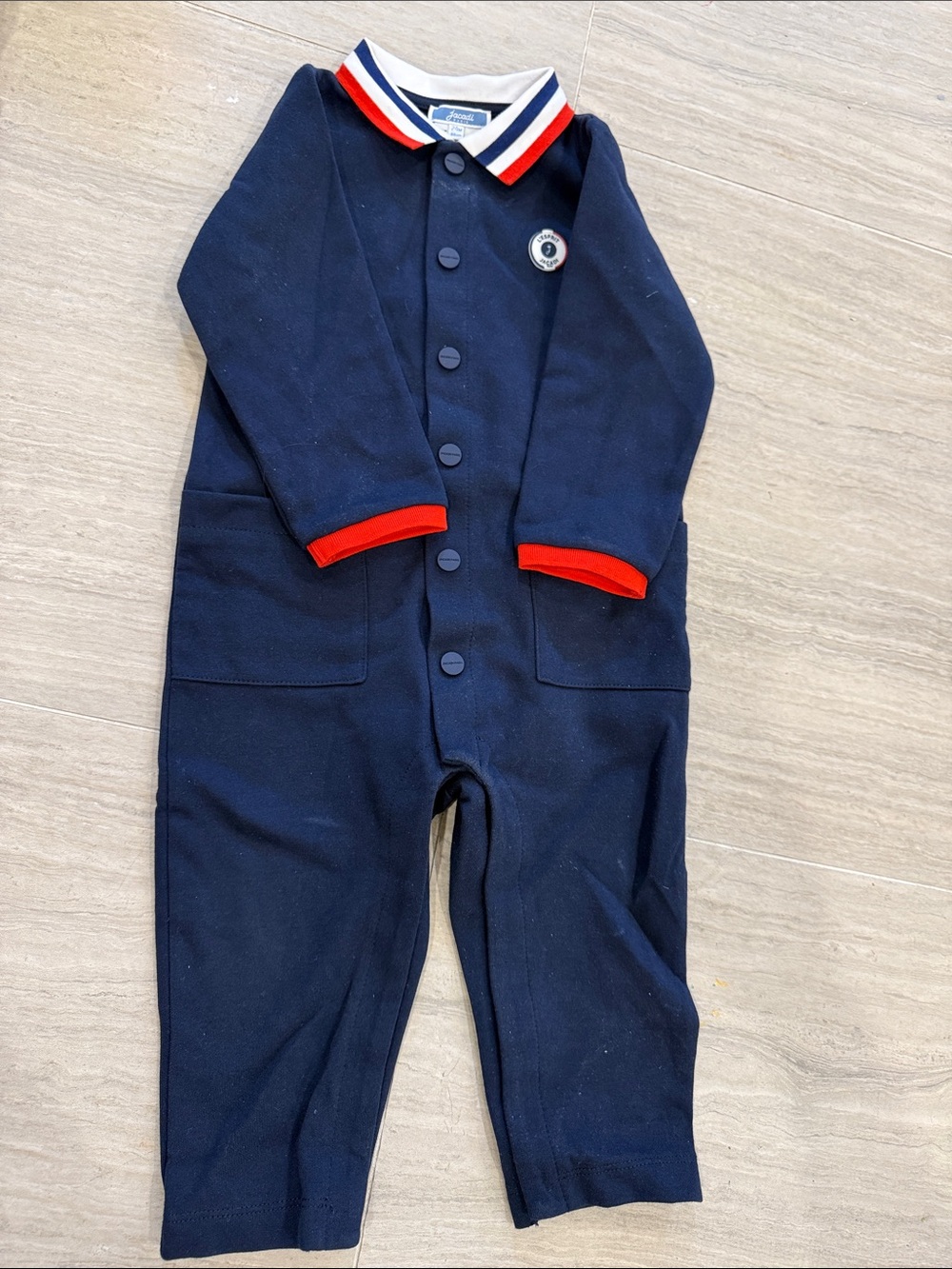 Jacadi Navy One-Piece Romper with Red Trim